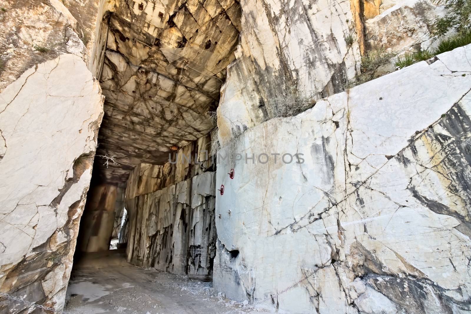 White Carrara marble quarry made in the gallery. The use of diamond tools allows to dig the marble blocks in underground galleries.