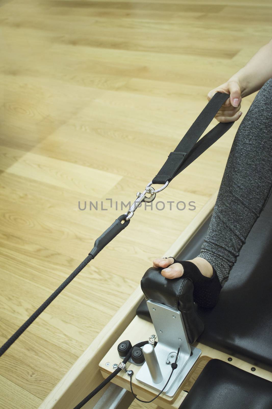 Woman doing pilates machine exercises