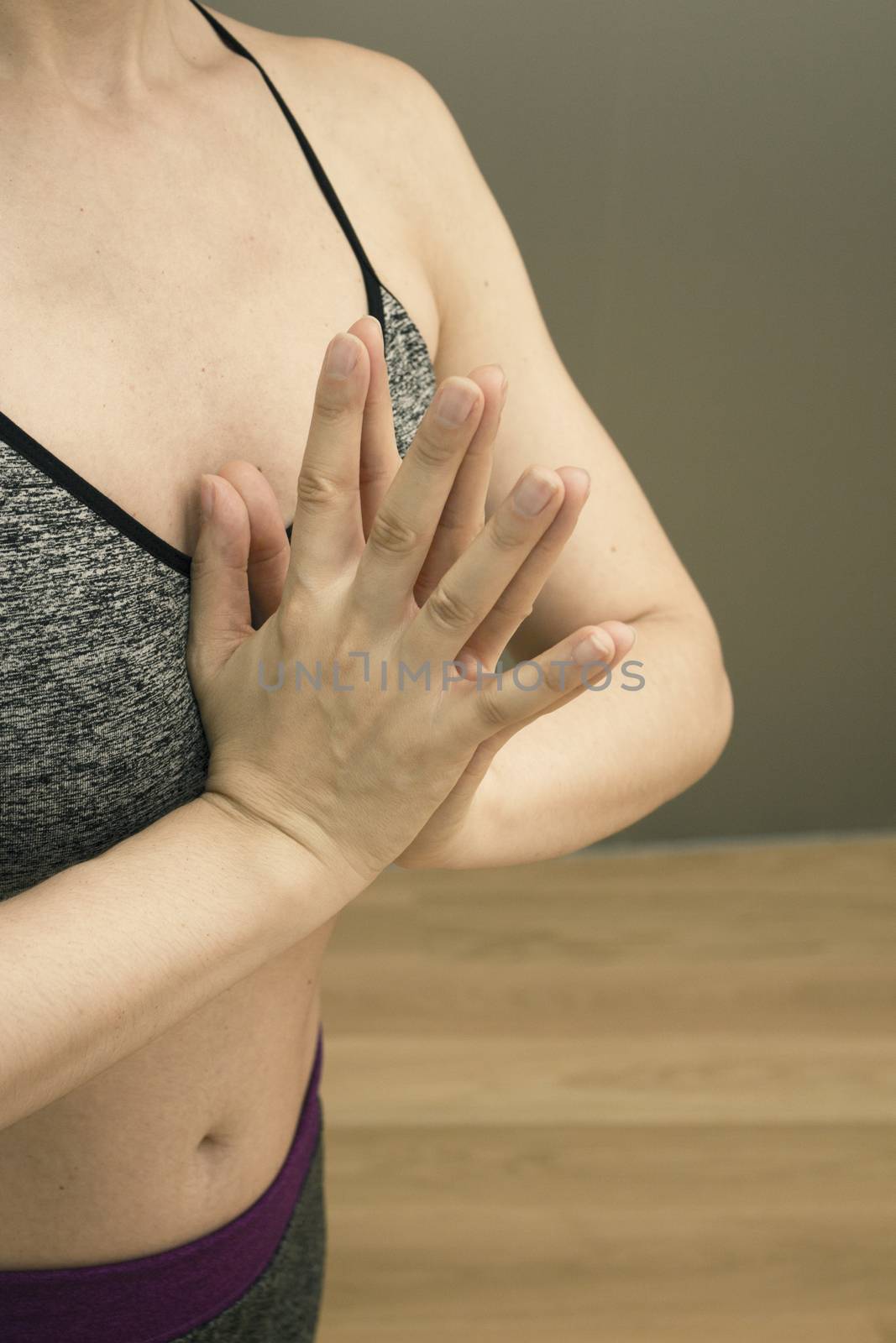 Womans hands practicing yoga and meditation positions by GemaIbarra