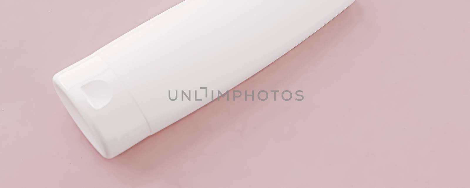 Moisturizing hand cream or body lotion on pink background, beauty product and skin care cosmetics, flatlay