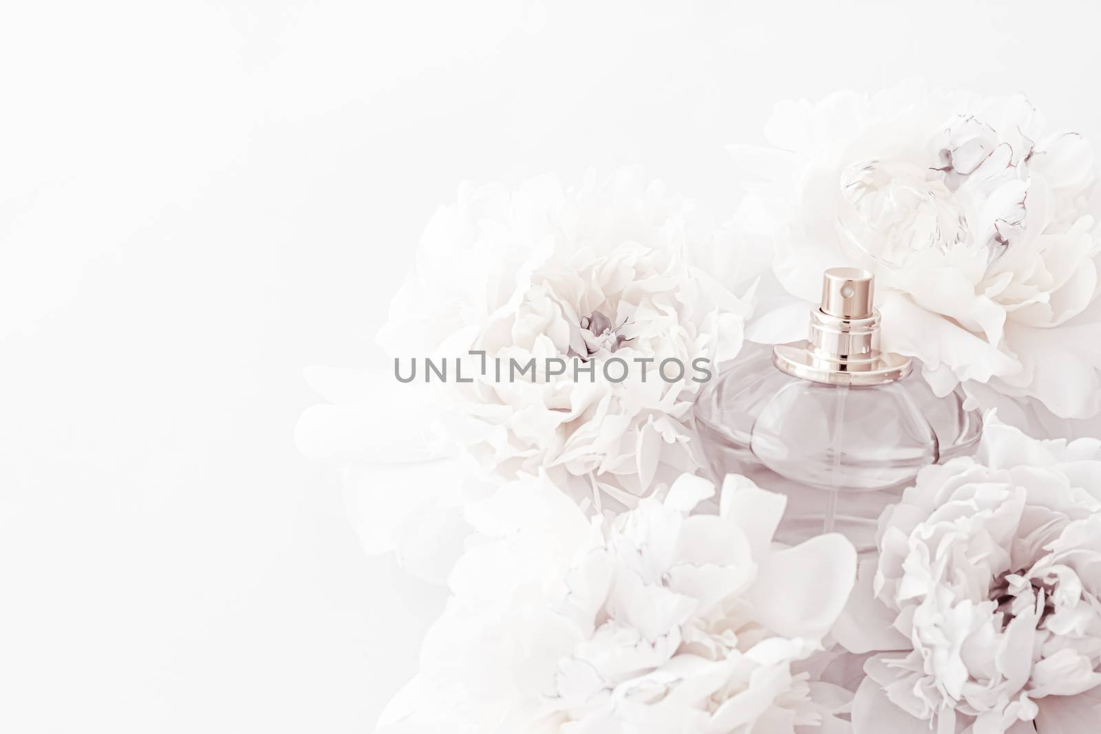 Chic fragrance bottle as luxe perfume product on background of peony flowers, parfum ad and beauty branding by Anneleven