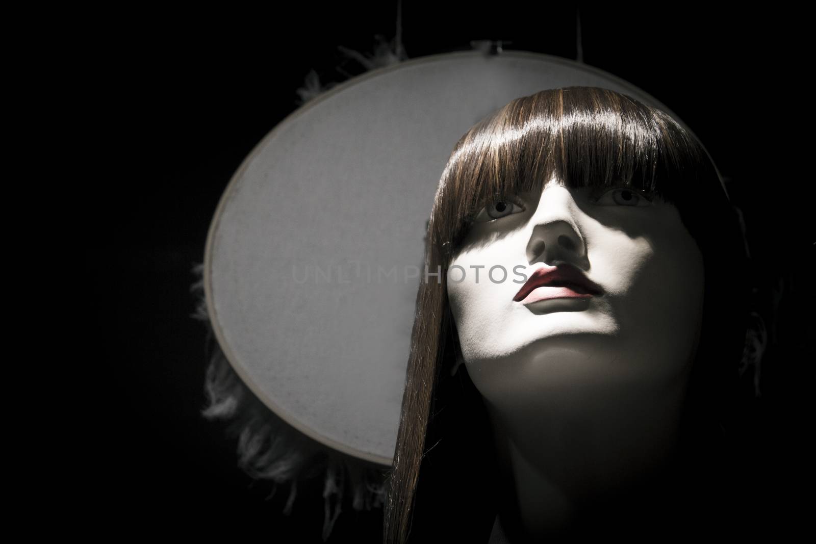 Portrait of female mannequin with reddish hair. No people