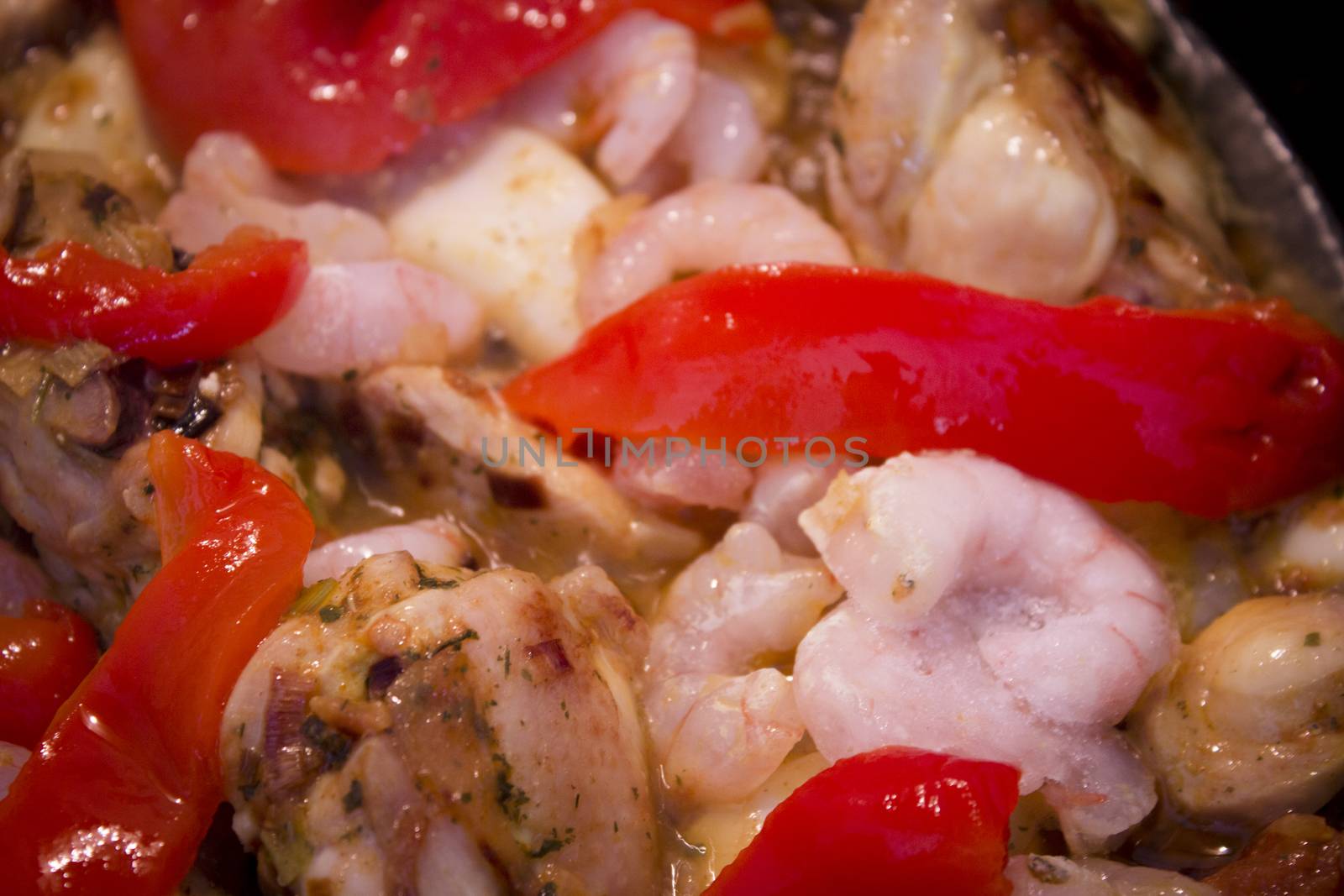 Vegetable stir fry with seafood and chicken to prepare paella. No people