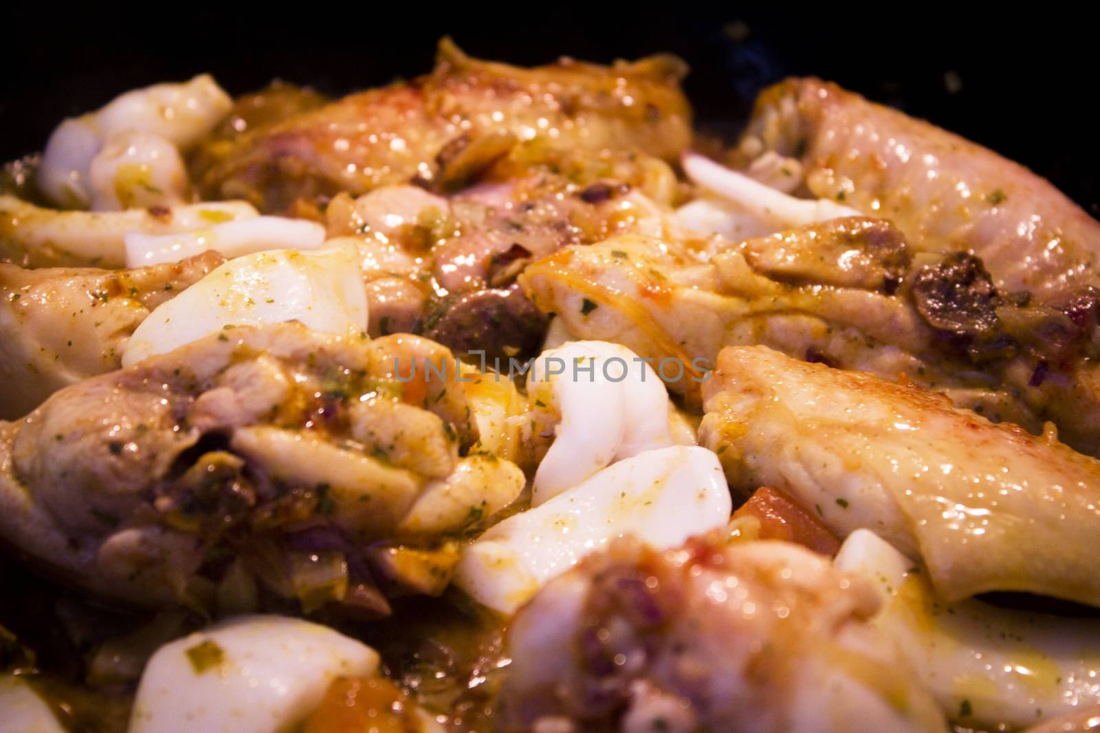 Vegetable stir fry with seafood and chicken to prepare paella. No people