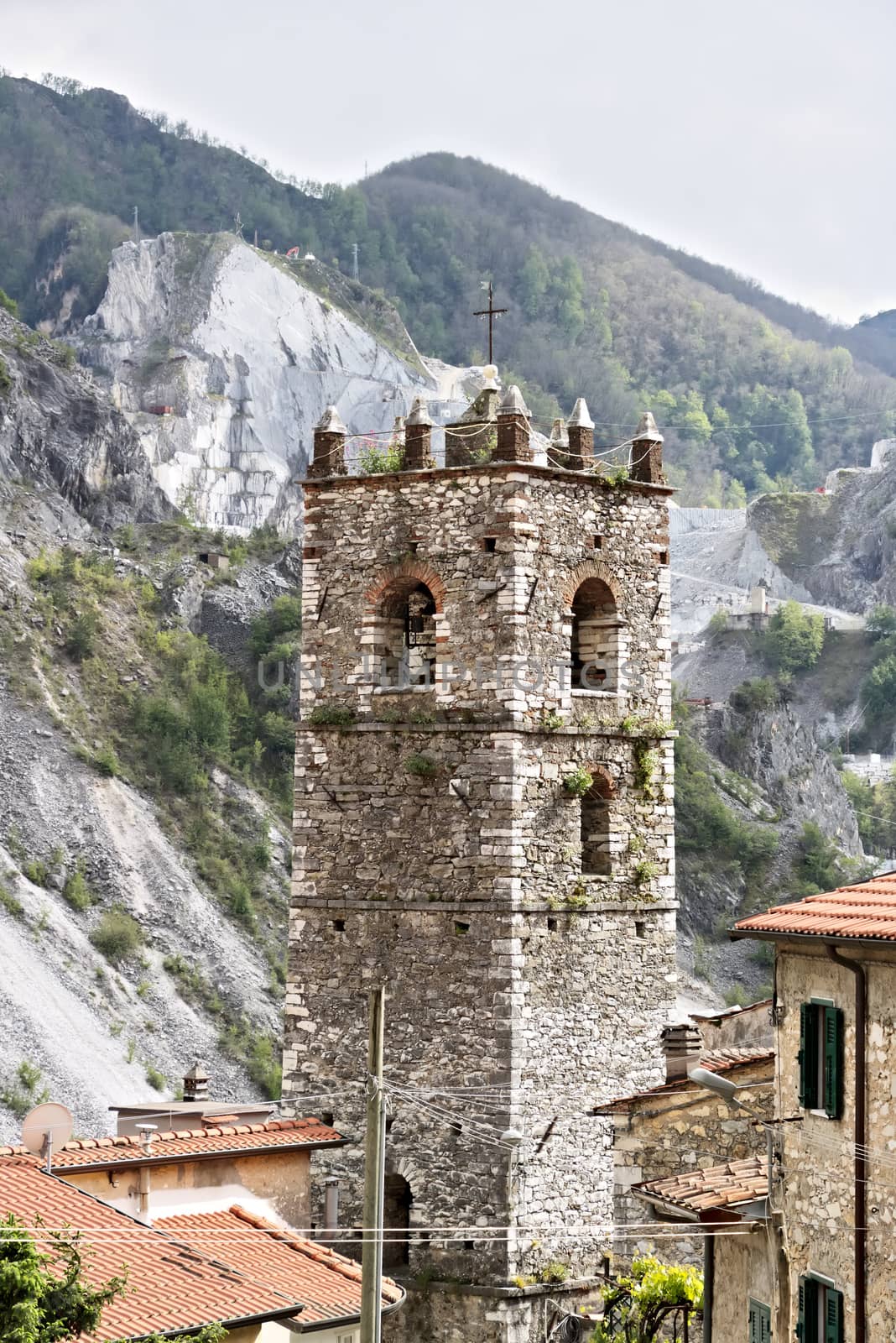 Bell tower of the church built with white marble pebbles.   Colo by Paolo_Grassi