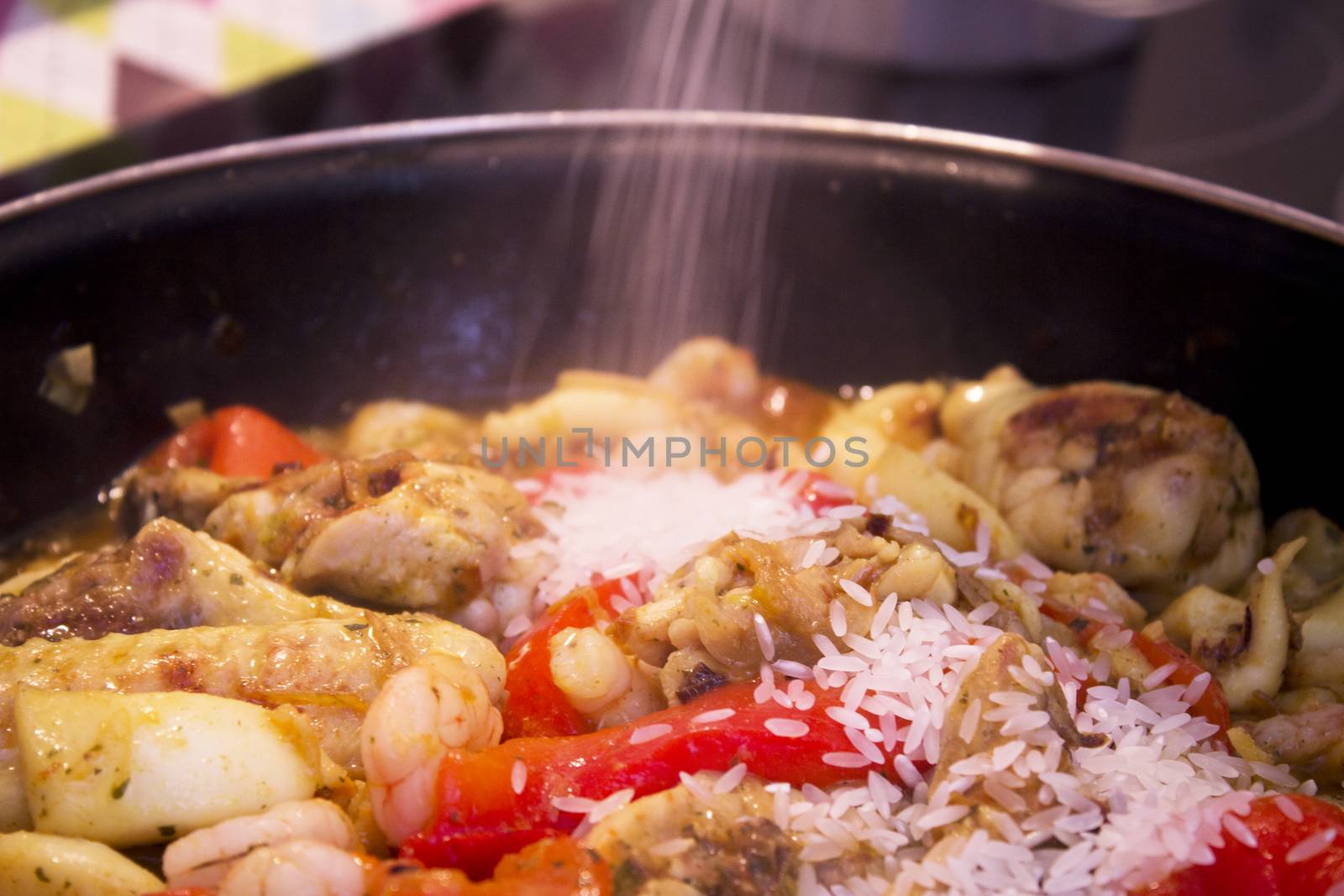 Vegetable stir fry with seafood and chicken to prepare paella. No people