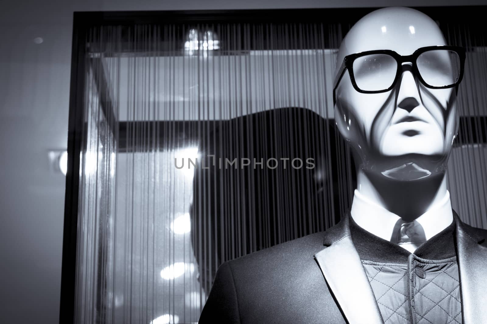 Male mannequin with glasses elegant dress. No people