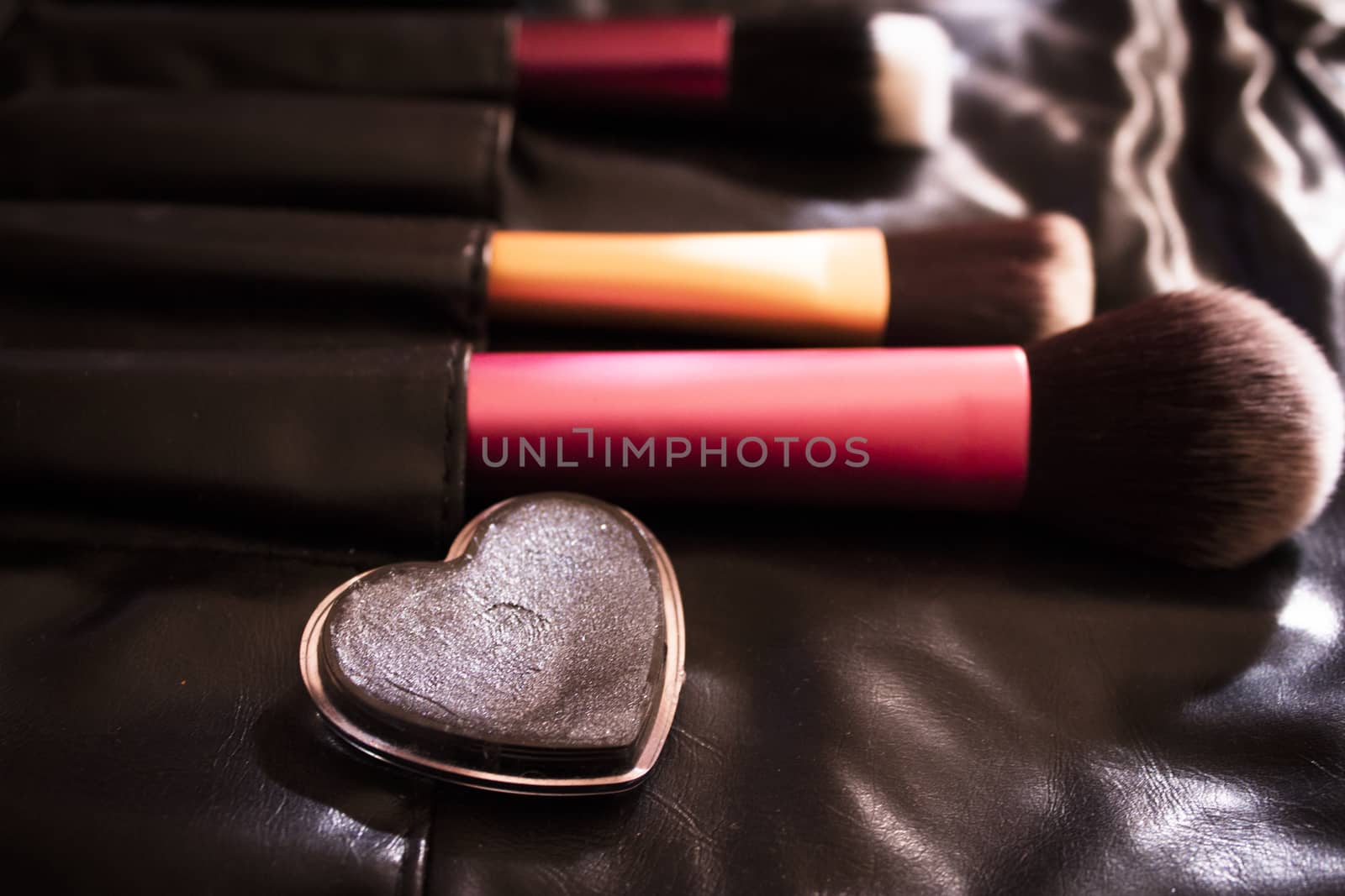 Facial makeup, eyeshadow and makeup brushes. No people