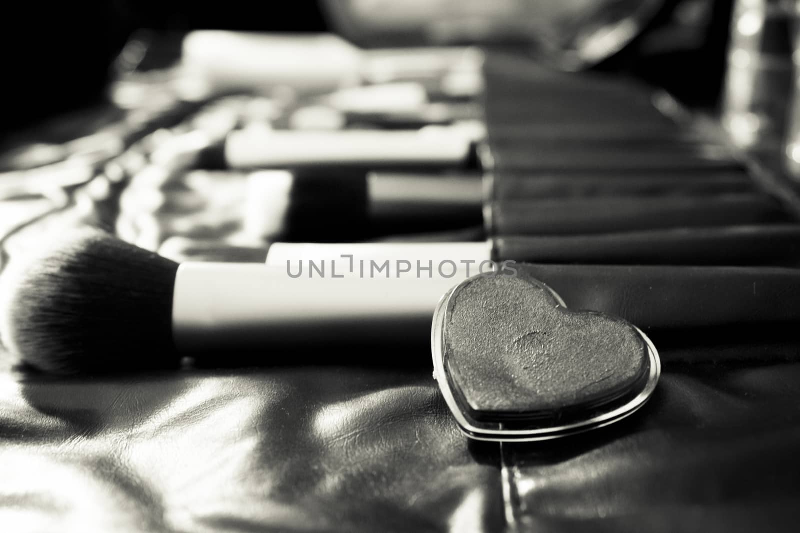 Facial makeup, eyeshadow and makeup brushes. No people
