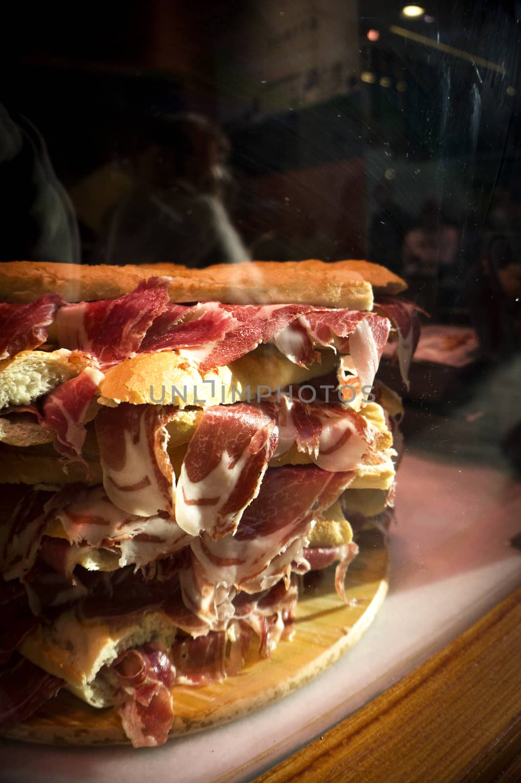 Serrano ham sandwiches stacked. No people