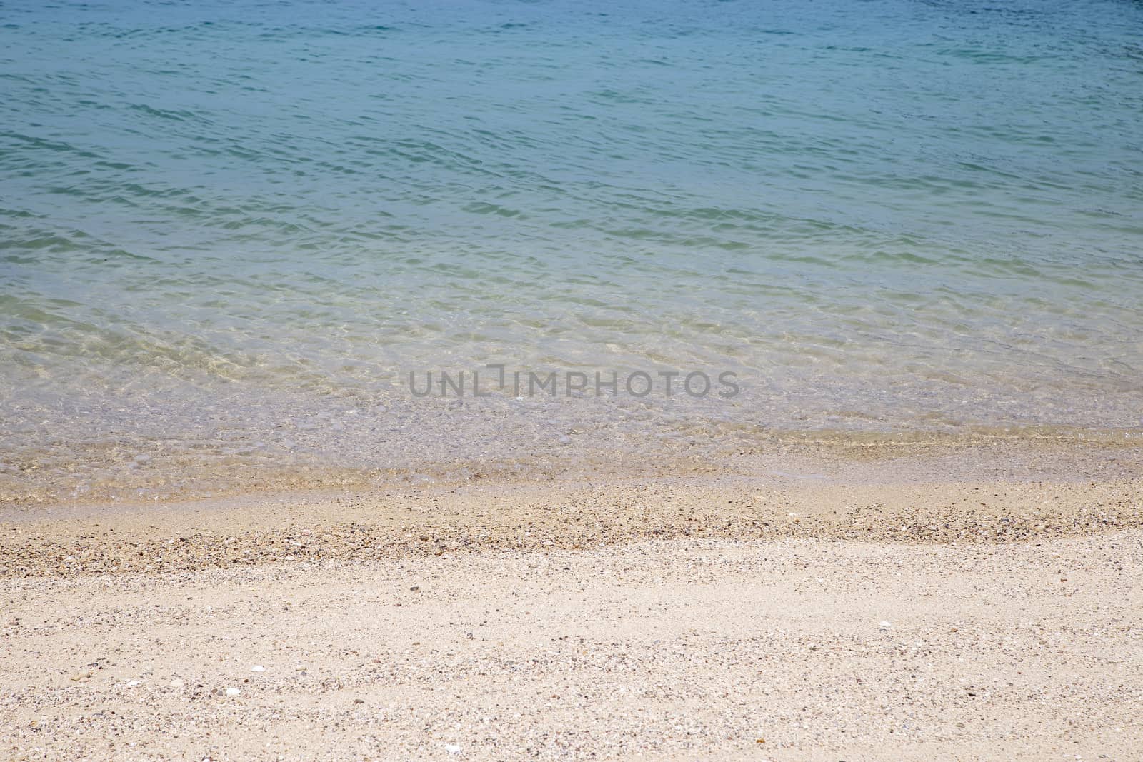 Sea soft wave and sand beach