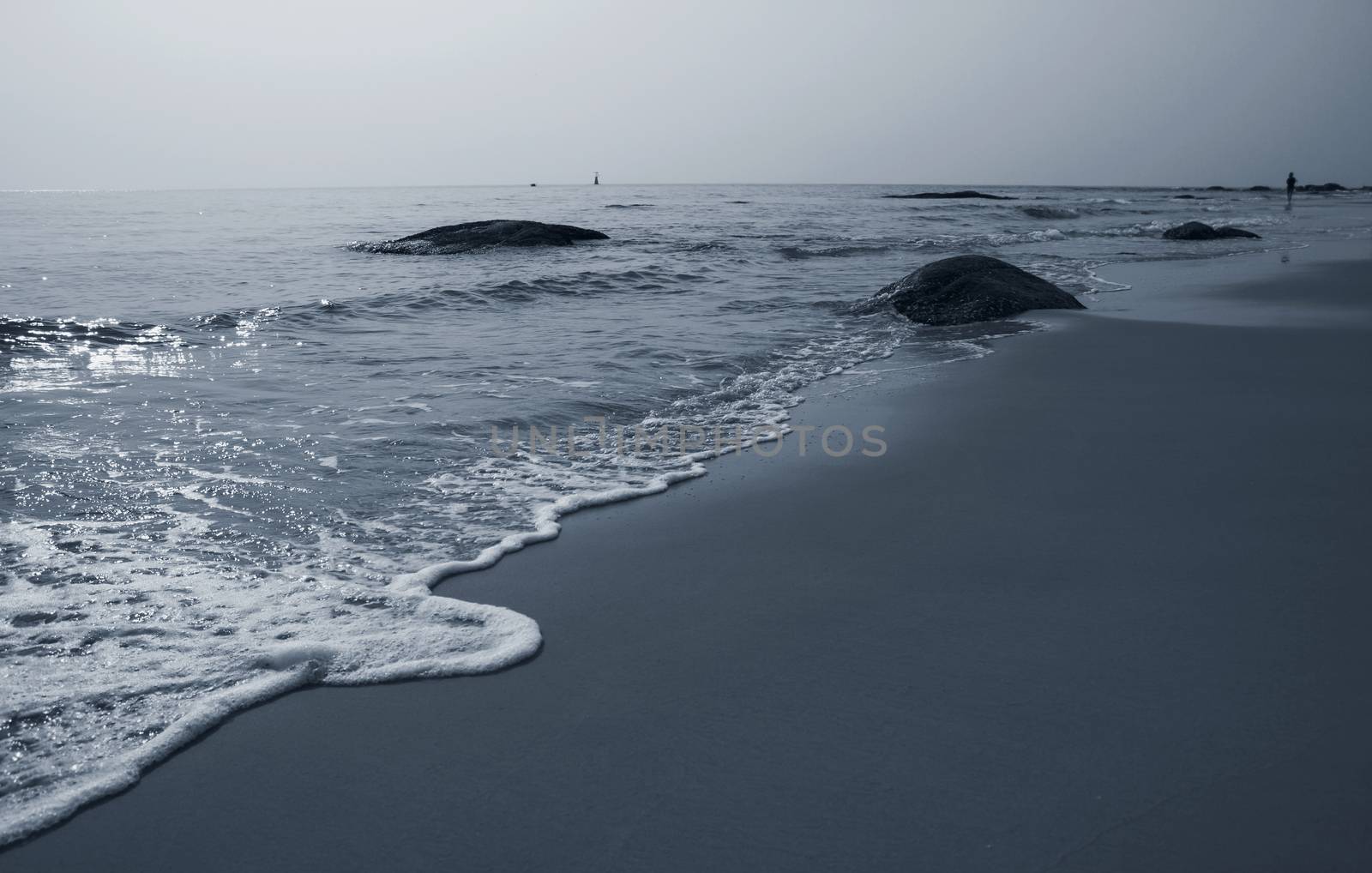 Sad concept of Lonely woman walking on the beach monotone color summer background