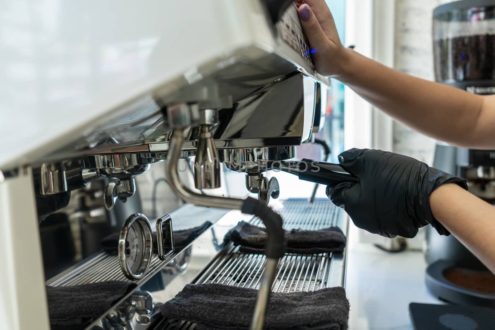 Barista make a coffee with coffee maker at cafe