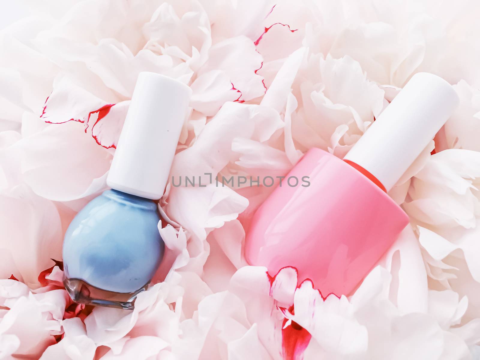 Nail polish bottles on floral background, french manicure and cosmetic branding by Anneleven