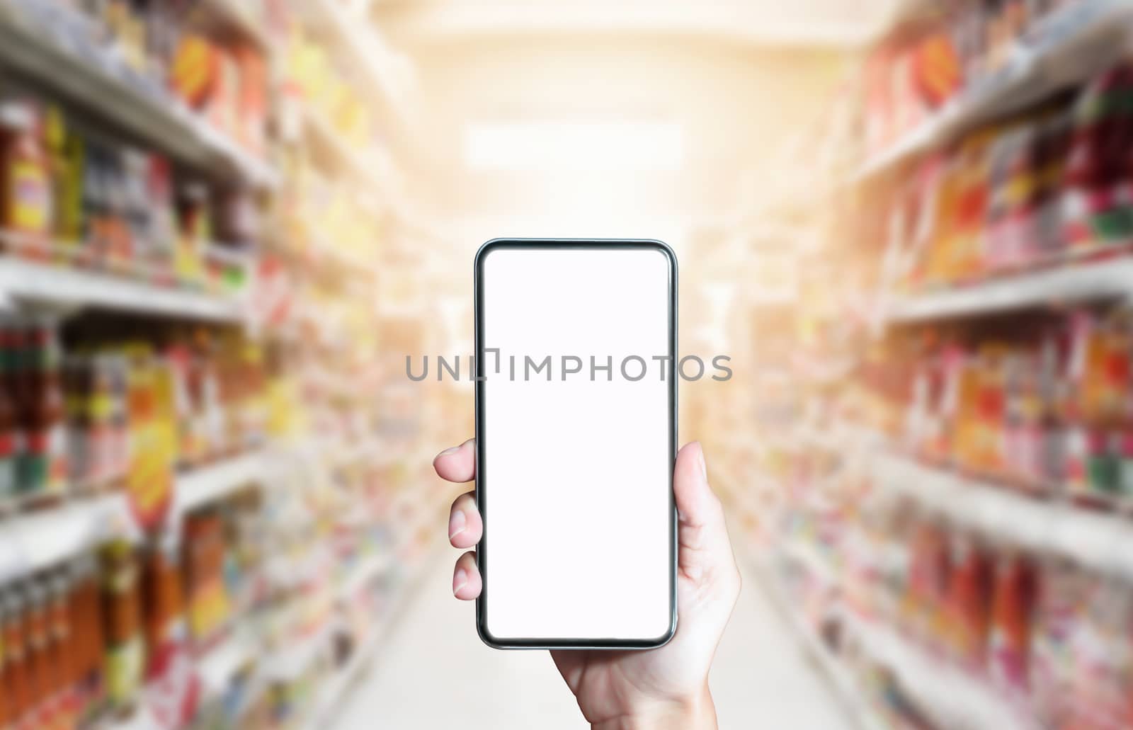 Using smartphone for shopping online on abstract supermarket bac by Buttus_casso