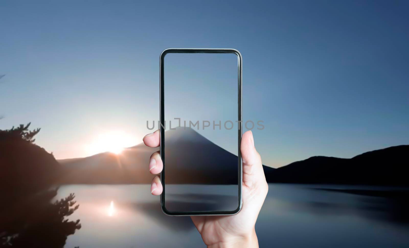 Photographer holding smartphone for take photo. Travel concept.