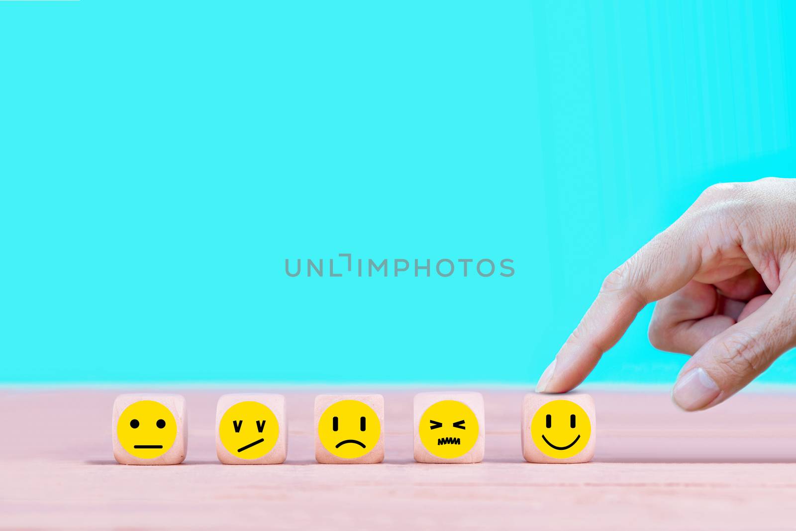 Businessman chooses a happy emoticon icons face.  Service, commu by Buttus_casso