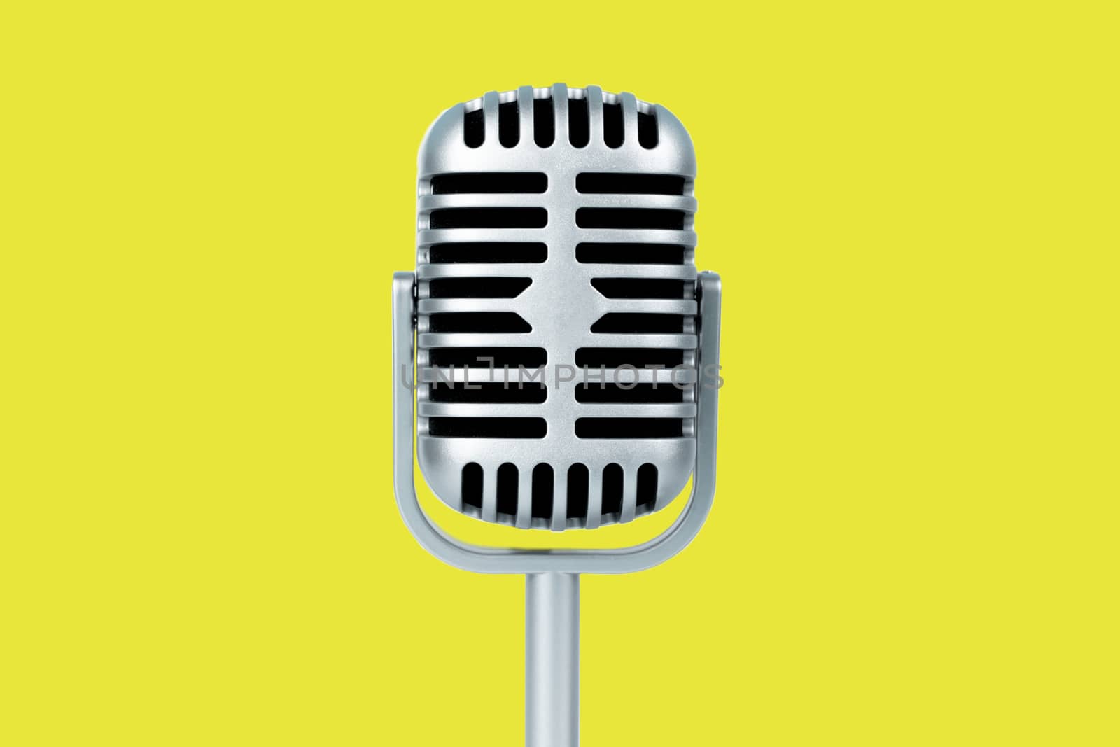 Microphone retro on yellow background
