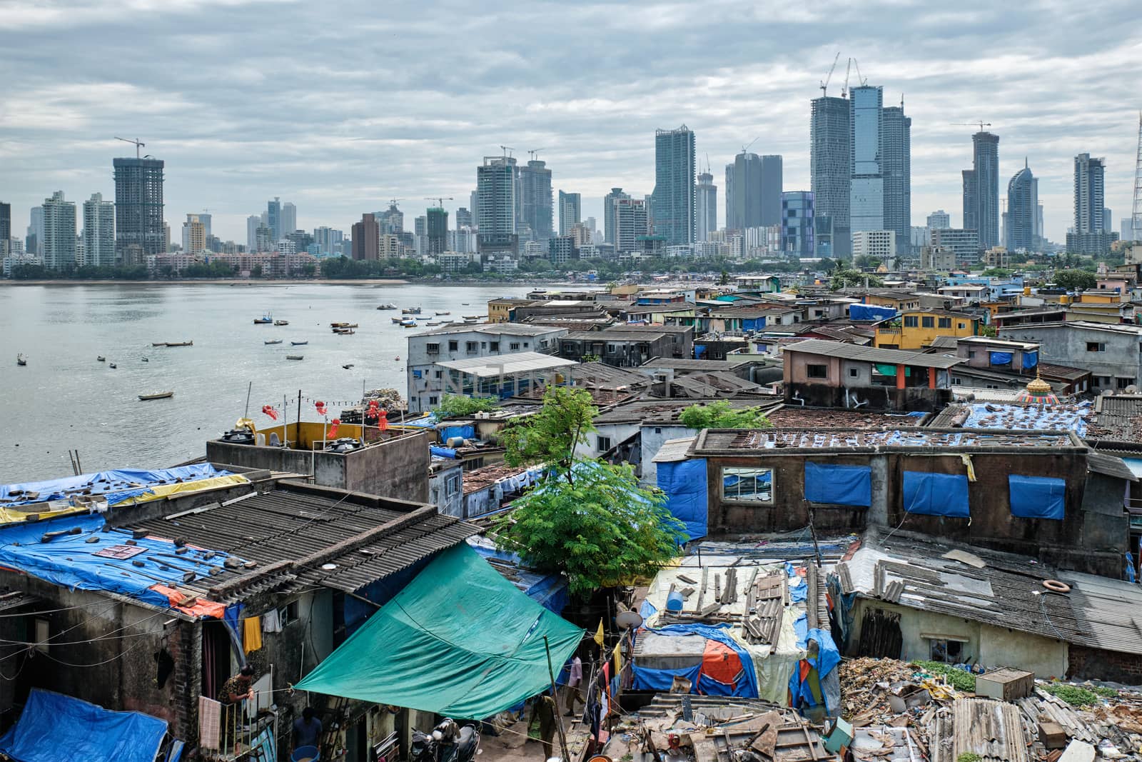 View of Mumbai skyline with skyscrapers over slums in Bandra suburb. Mumbai, Maharashtra, India