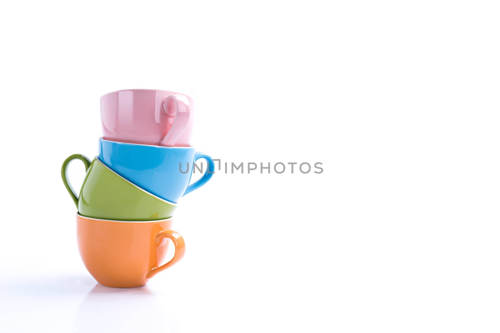 Stacked ceramic cup with copy space on isolated white by Buttus_casso