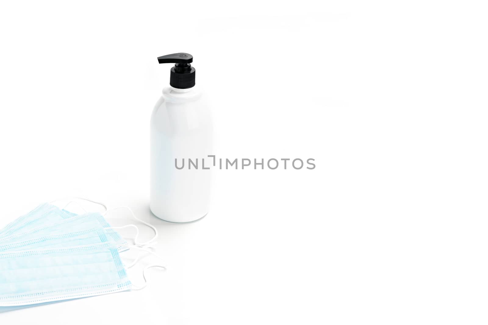 Gel alcohol with health masks with copy space on isolated white