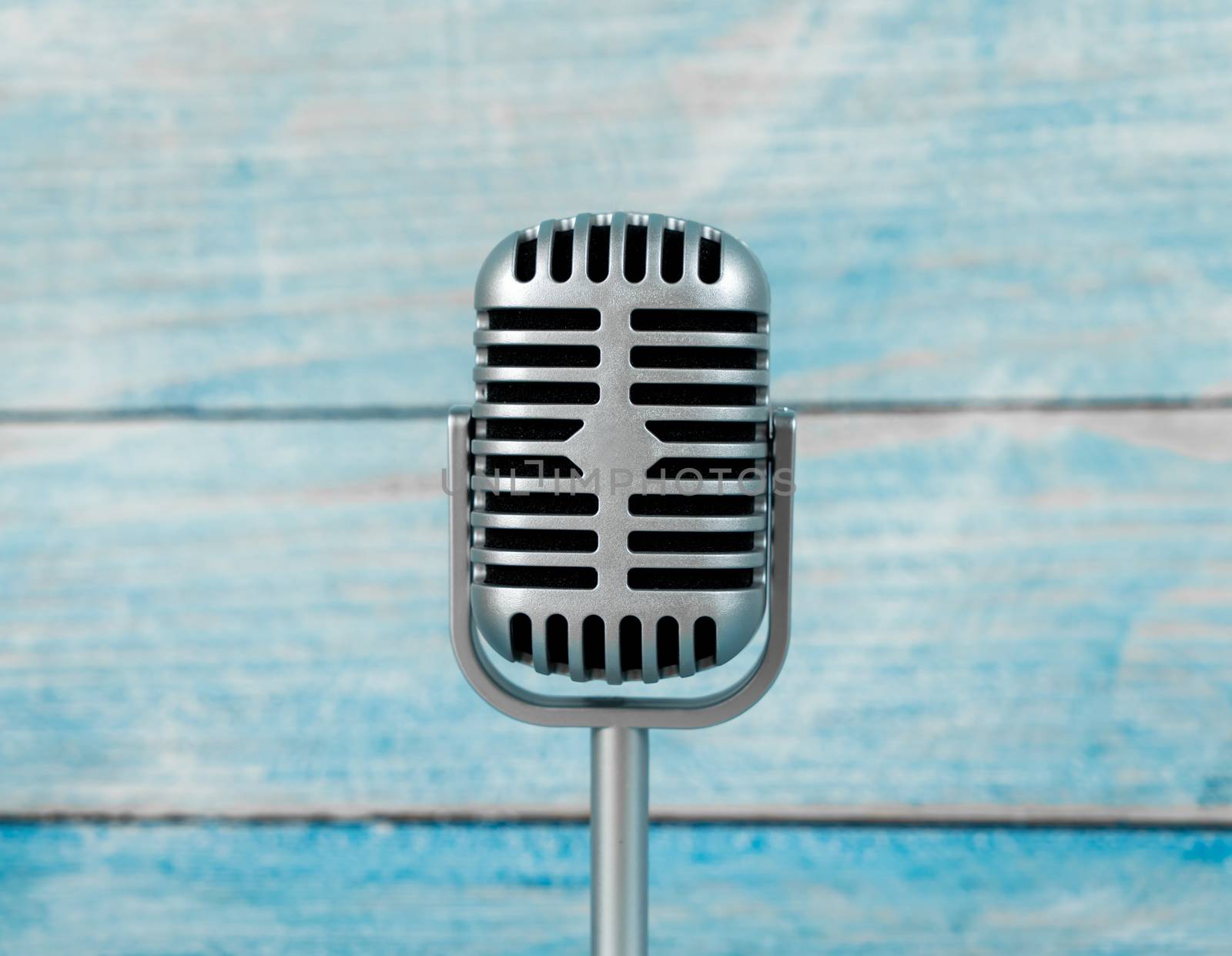 Microphone retro on wooden background by Buttus_casso