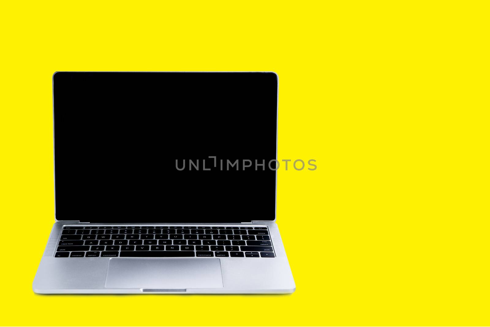 Laptop and mock up screen on yellow background