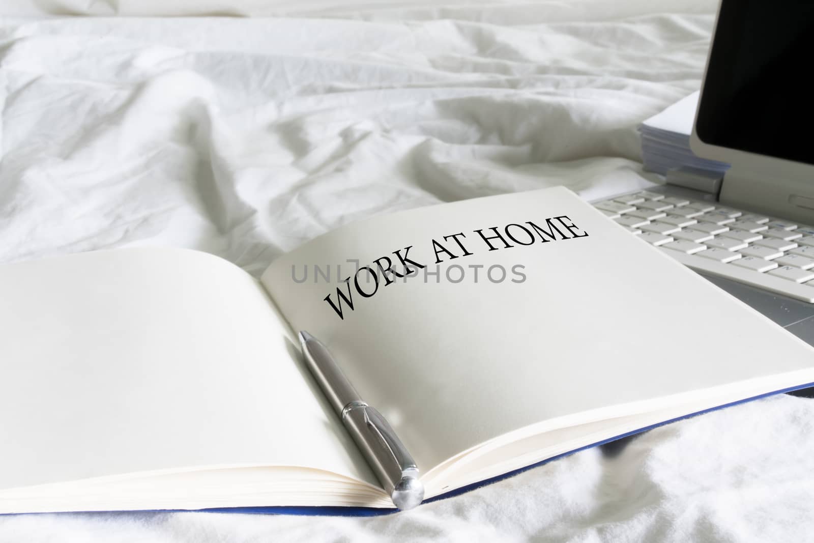Work at home text on book with laptop