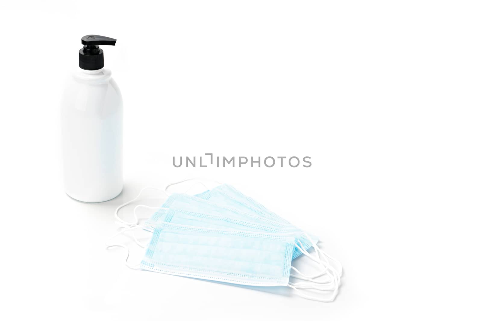 Gel alcohol with health masks with copy space on isolated white