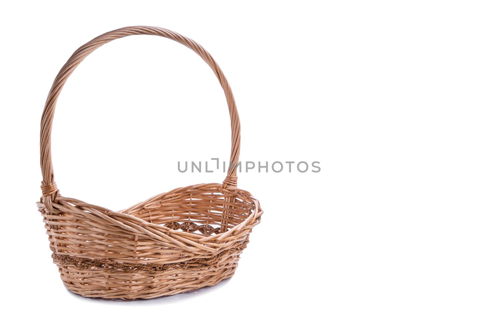 Wicker basket with copy space isolated on white background by Buttus_casso