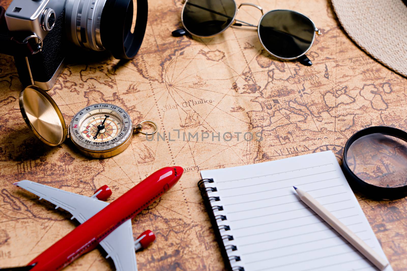 Compass with accessories for travel planning by Buttus_casso