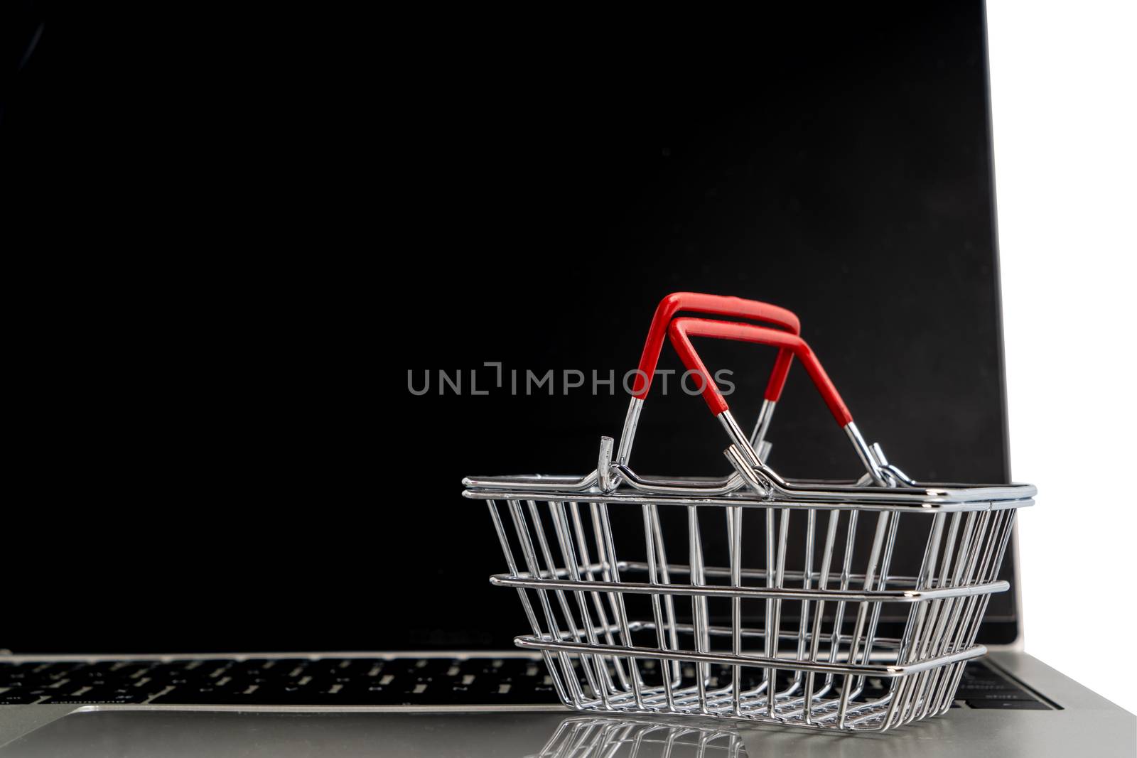 Shopping online concept.  Basket shopping on laptop. by Buttus_casso
