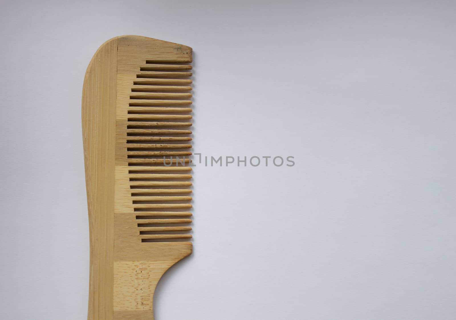 Wooden comb isolated on white background with clipping path