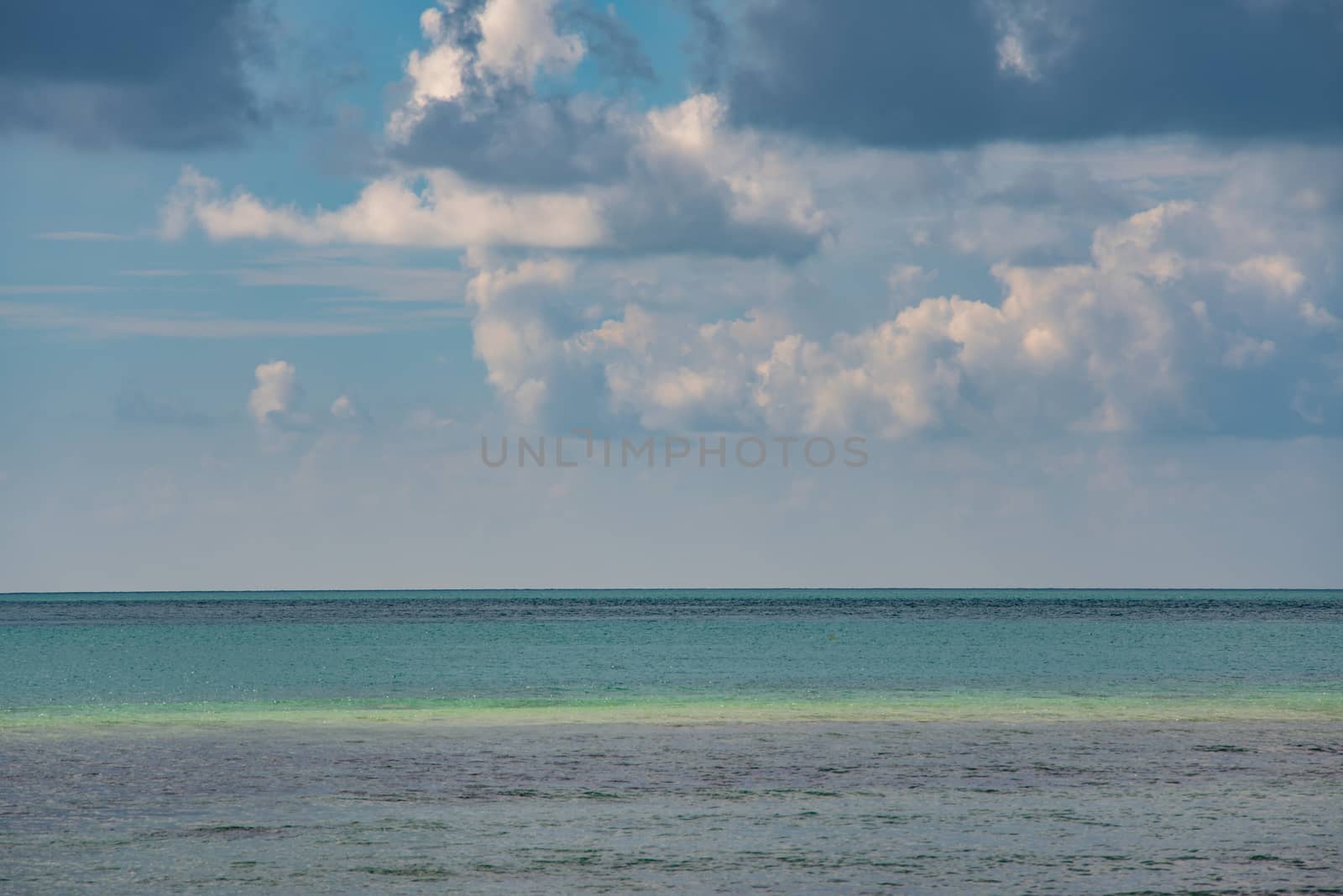 Blurred photo scenery the sea and blue sky with clouds by Buttus_casso