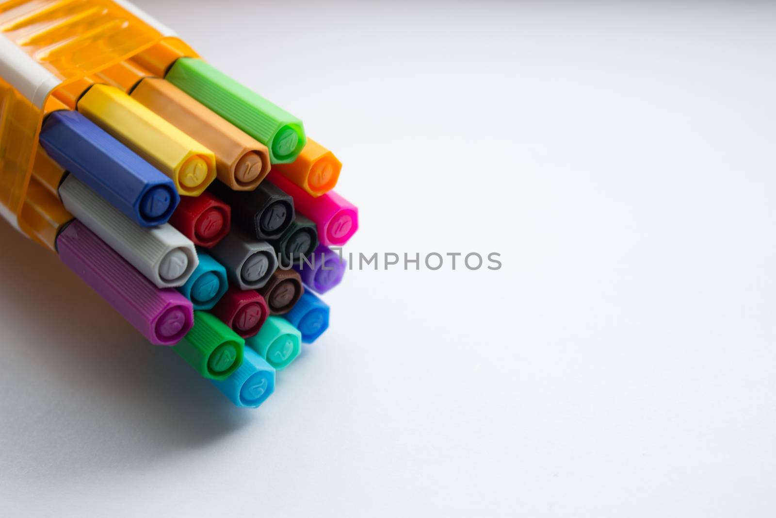 Many different colored pens. Color pencils isolated on a white background.