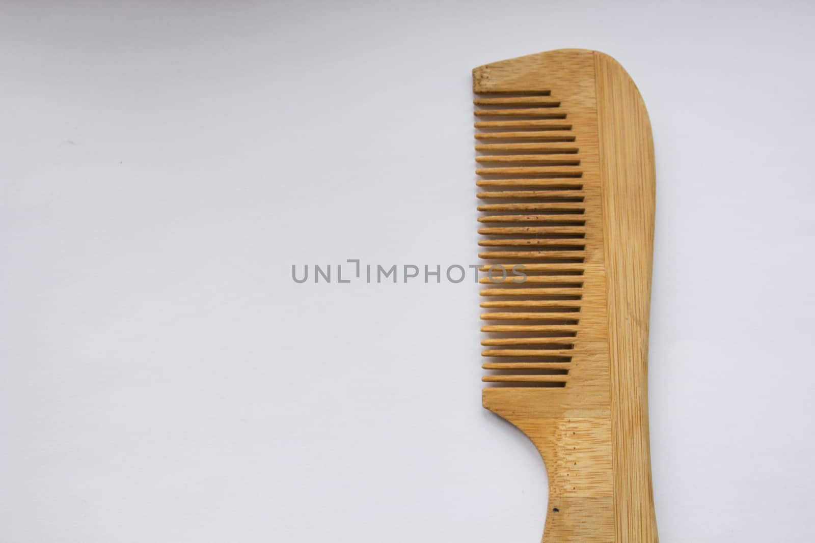 Wooden comb isolated on white background with clipping path