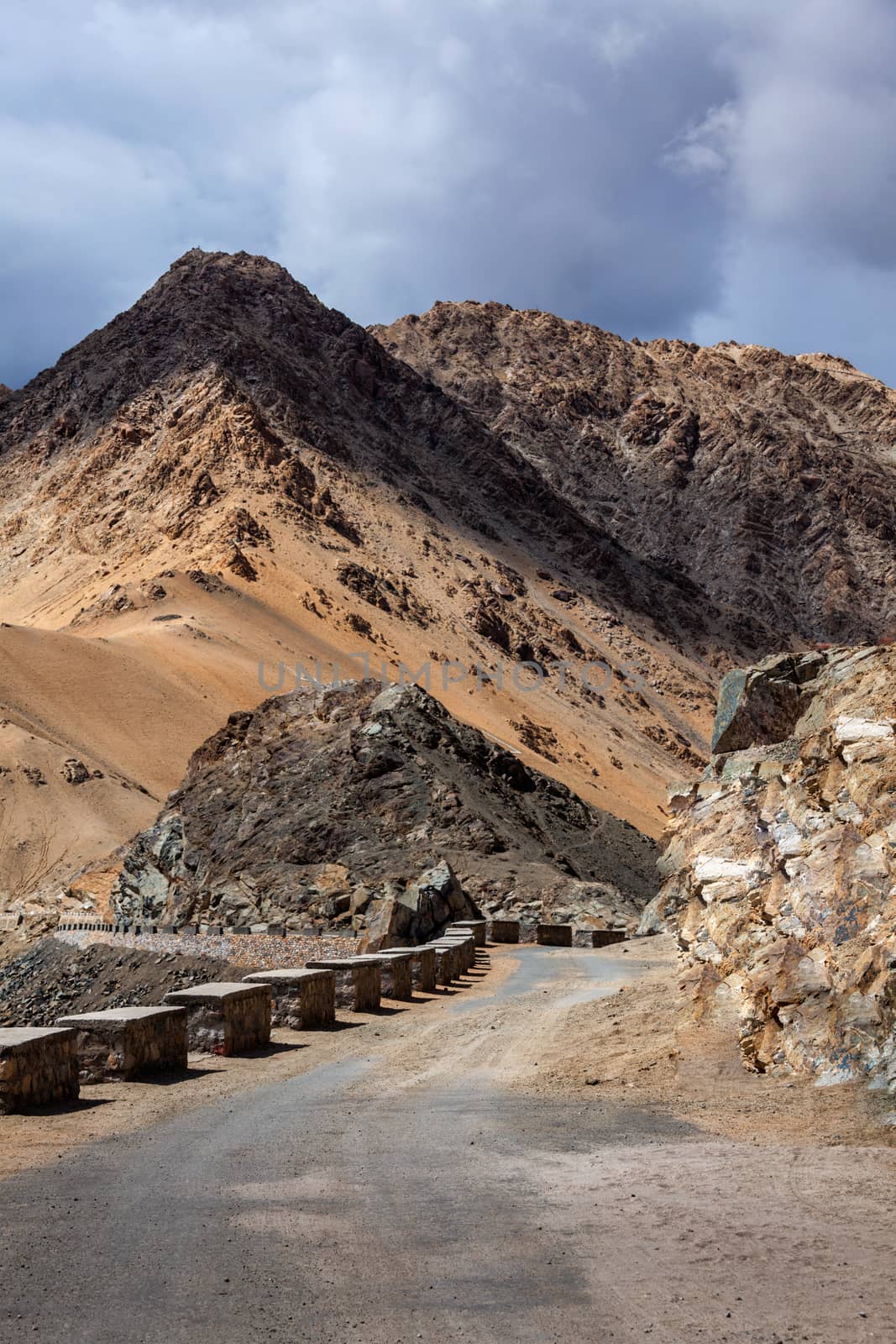 Road in Himalayas with mountains by dimol