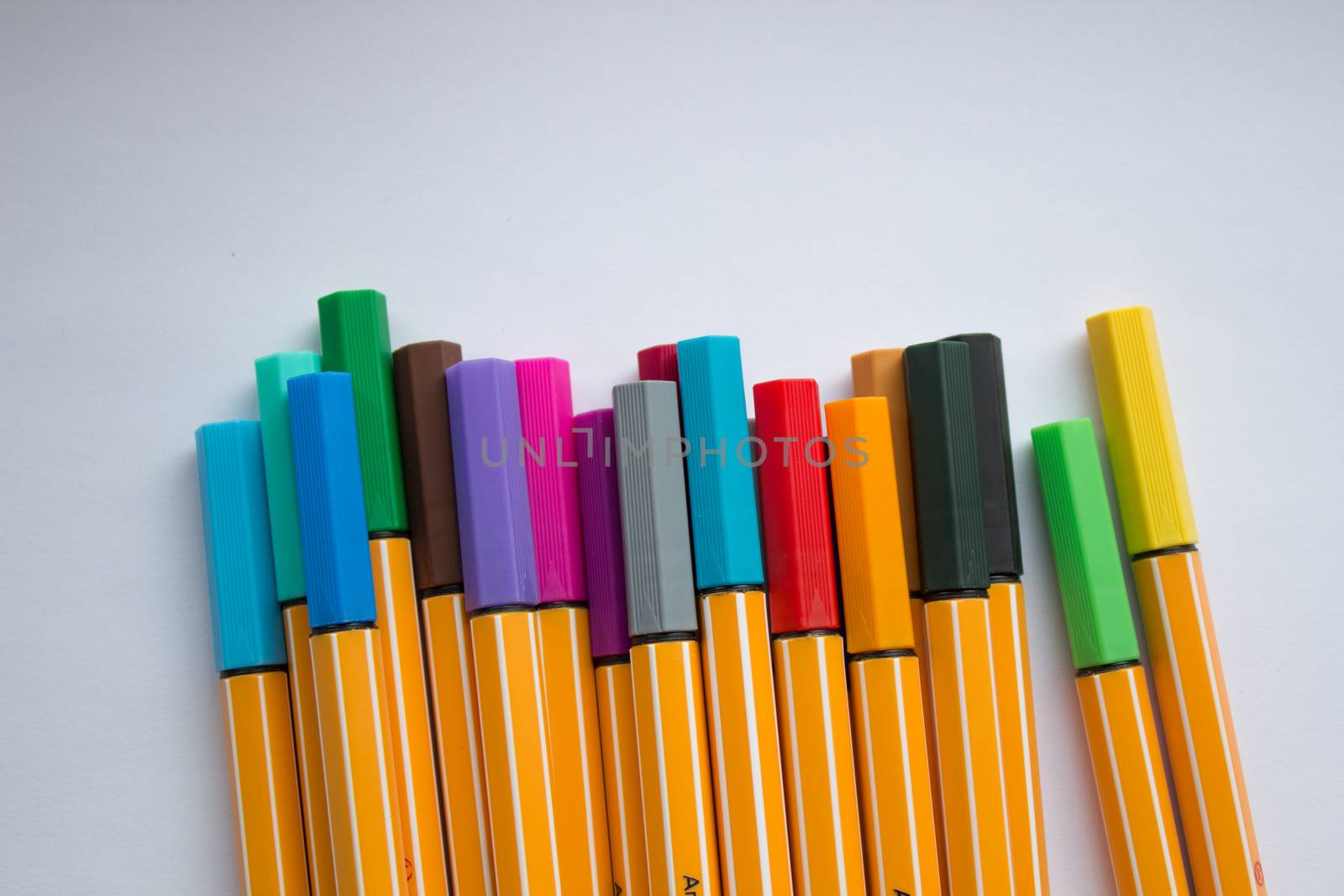 Many different colored pens. Color pencils isolated on a white background by AnatoliiFoto