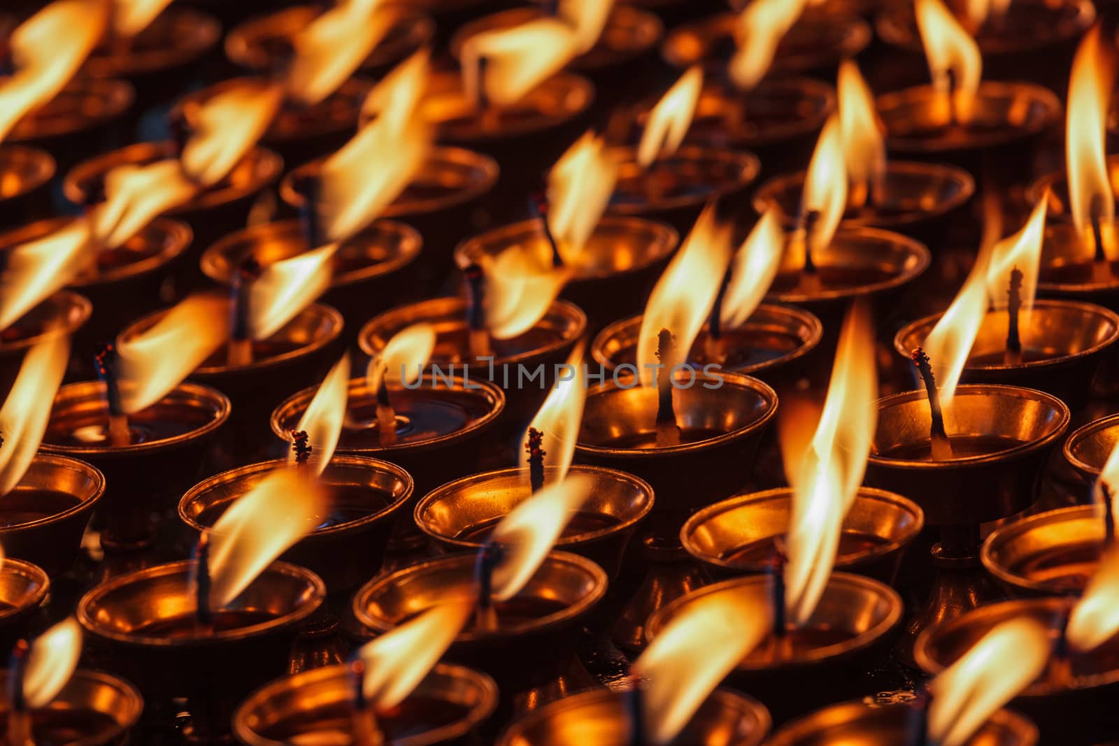 Burning candles in Buddhist temple. Dharamsala, Himachal Pradesh