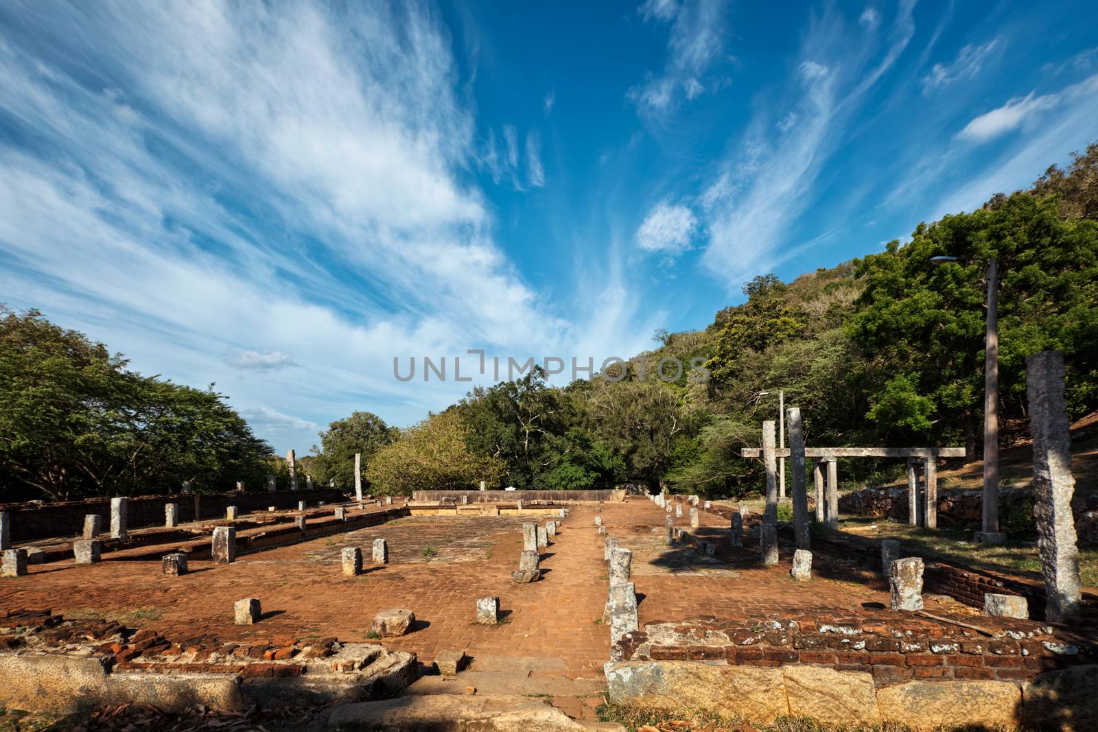 Column ruins and basement at Mahaseya Dagoba Buddhist monastery. Mihintale, Sri Lanka by dimol