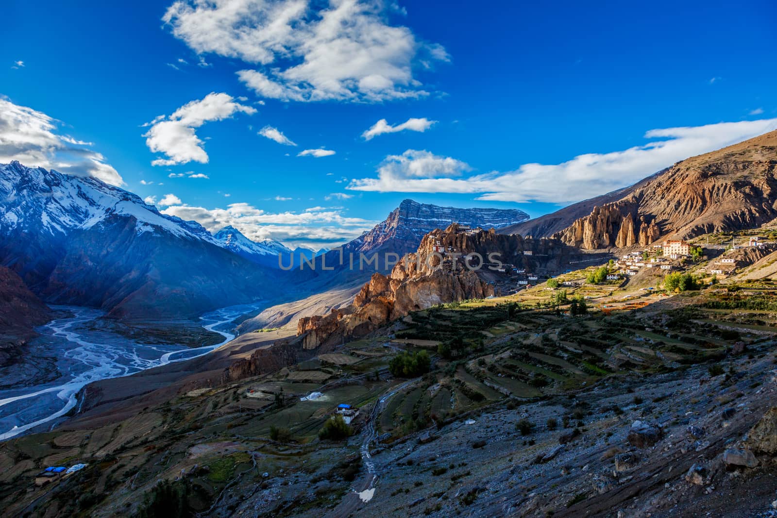 Dhankar monastry perched on a cliff in Himalayas and Spiti valley on sunset. Dhankar, Spiti Valley, Himachal Pradesh, India