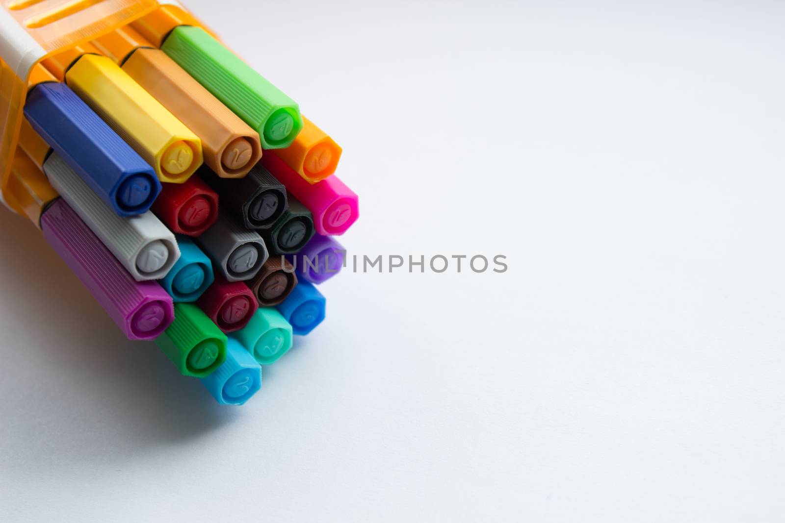 Many different colored pens. Color pencils isolated on a white background.