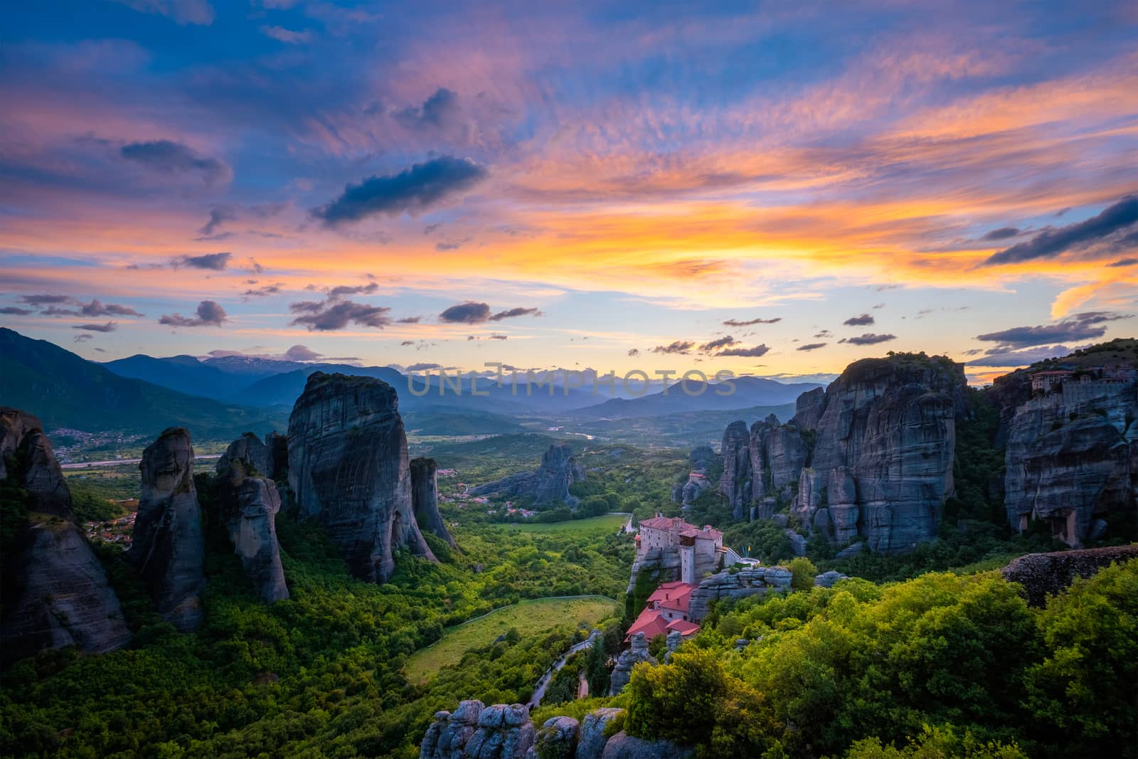 Sunset sky and monasteries of Meteora by dimol