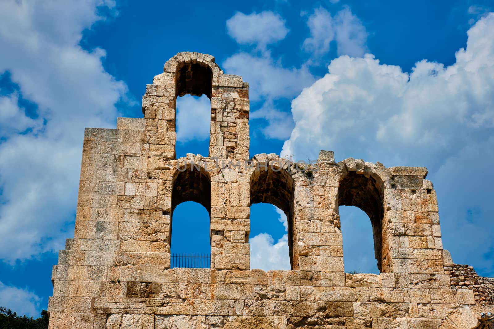 Ruins of Odeon of Herodes Atticus ancient stone Roman theater located on the southwest slope of the Acropolis hill of Athens, Greece. Athens, Greece