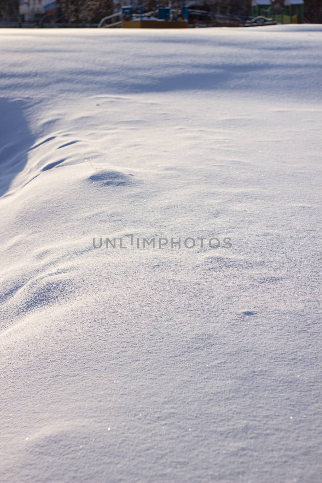 many tracks on the glade covered with snow, paths in the snow, snow-covered meadow by AnatoliiFoto