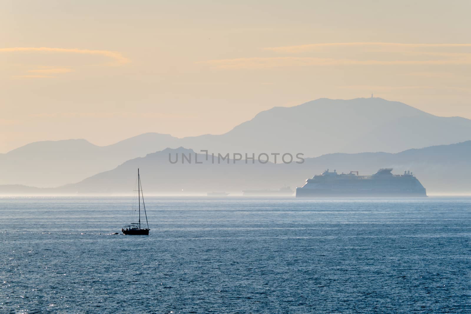 Cruise liner ship and yacht silhouette in Mediterranea sea. Aegean sea, Greece
