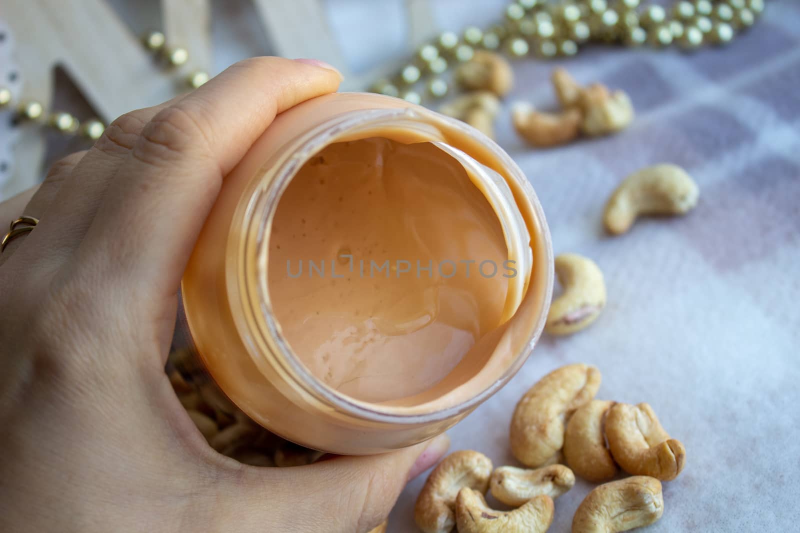 Creamy peanut butter and spoon on background by AnatoliiFoto