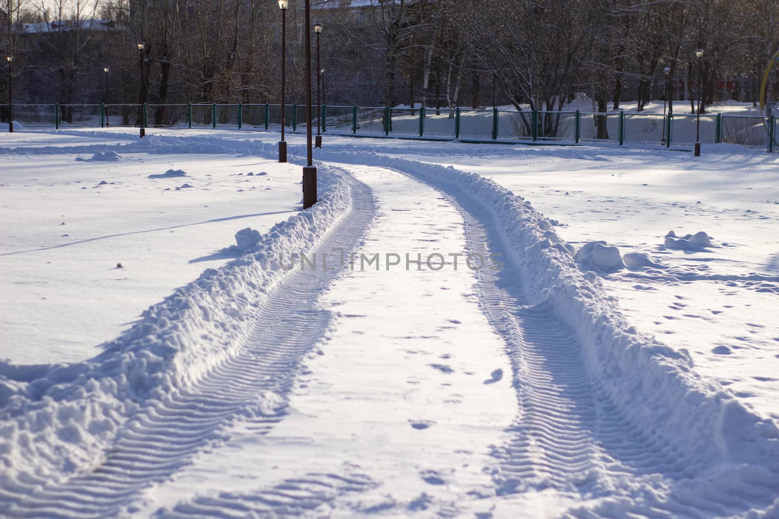 Fresh tracks from the tractor in the snow in winter. Snow clearance