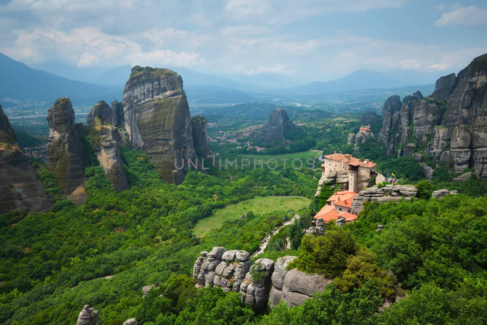Sunset over monastery of Rousanou and Monastery of St. Nicholas Anapavsa in famous greek tourist destination Meteora in Greece