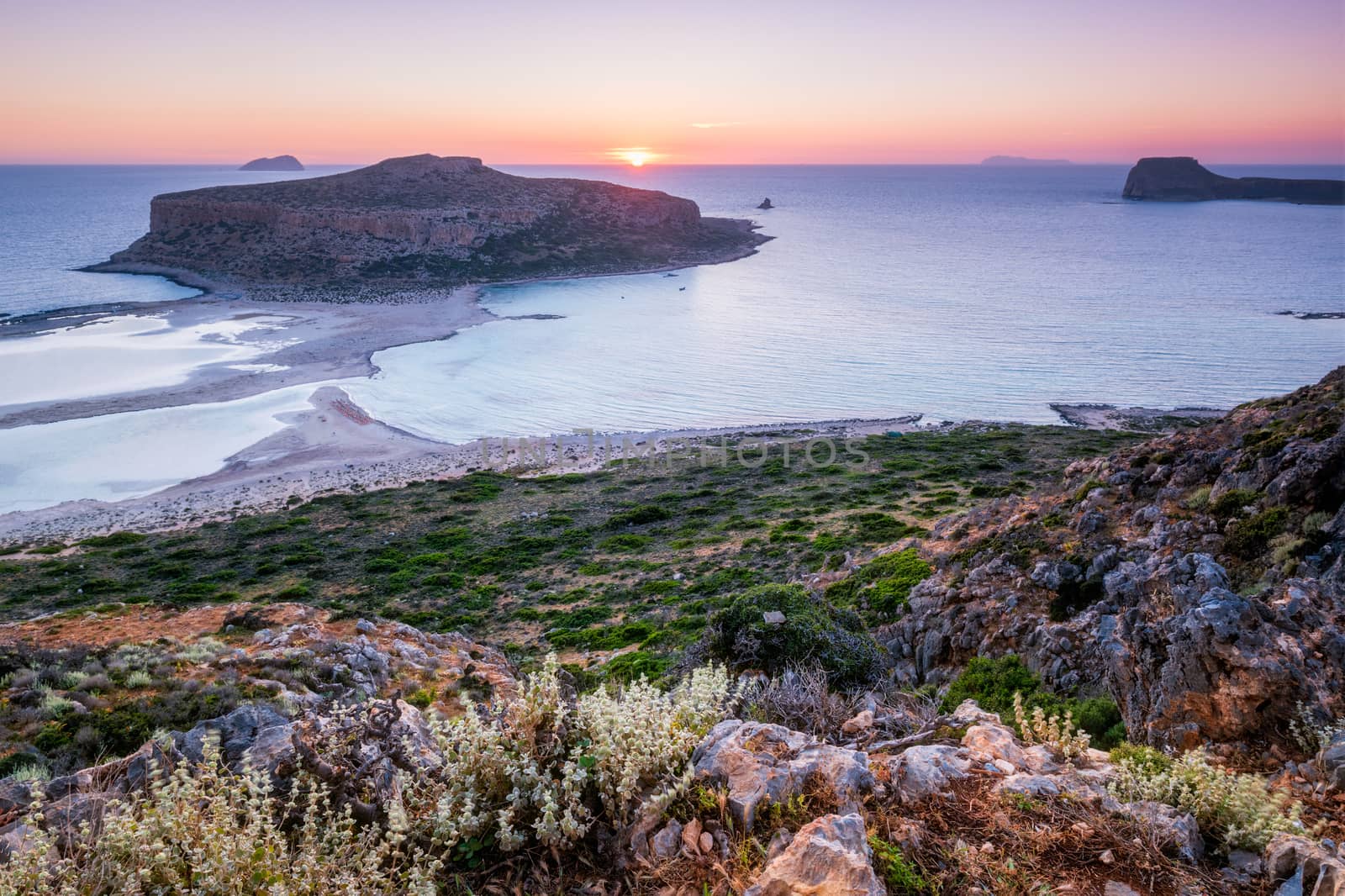 Island Gramvousa and the beautiful Balos beach on sunset in Crete island, Greece. Horizontal camera pan
